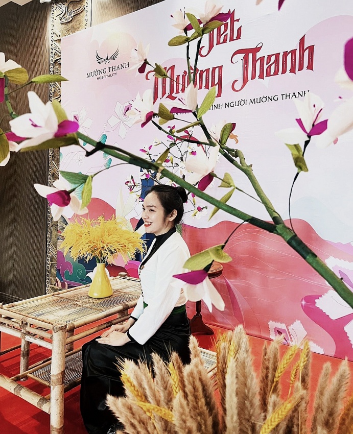The graceful Thai girl among Ban flowers at Muong Thanh Grand Hotel Ha Tinh