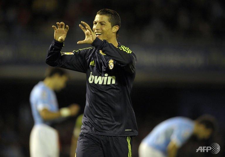 ronaldo double sees madrid past celta vigo