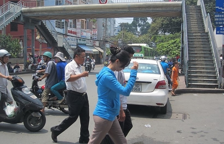 Grab encourages people to use pedestrian overpasses