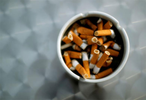 Smoking costs, global economy, tobacco taxes, kill