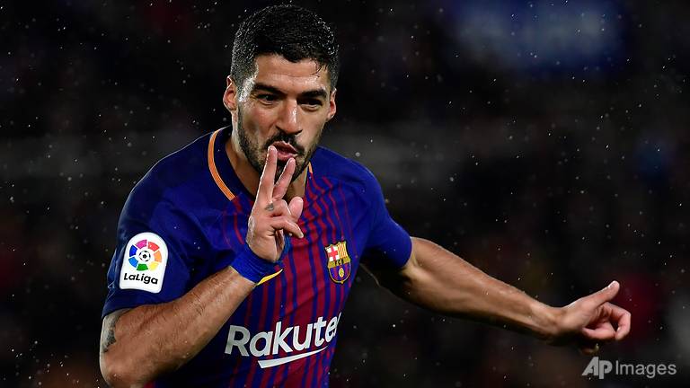 suarez fires barcelona nine clear in sociedad fightback