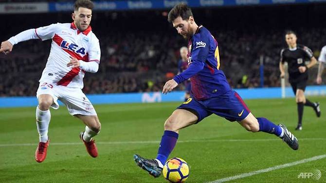 messi strikes late to down tough alaves