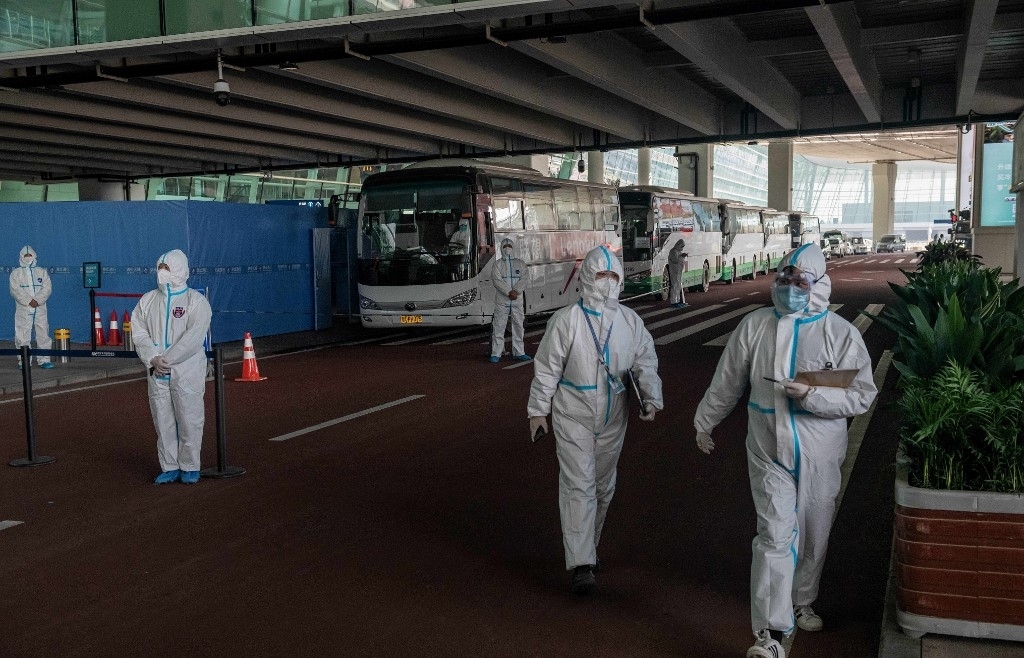 WHO team arrives in Wuhan as China reports first virus death in months