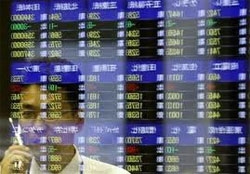 Asian stocks mixed, weaker yen lifts Tokyo
