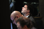 A stock trader works the floor of the New York Stock Exchange on February 21. US stocks closed broadly higher, helped by solid gains from Procter & Gamble over its cost-cutting plan and blue-chip stalwart IBM.