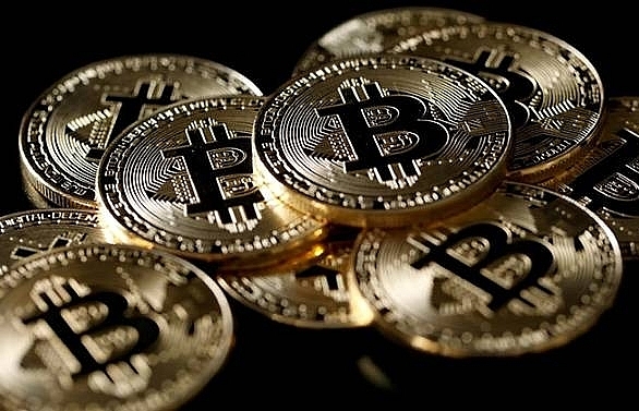 Bitcoin bounces back from three-month low in volatile trade