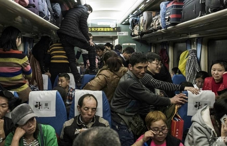 Millions of Chinese leave for New Year holidays, but many may not return