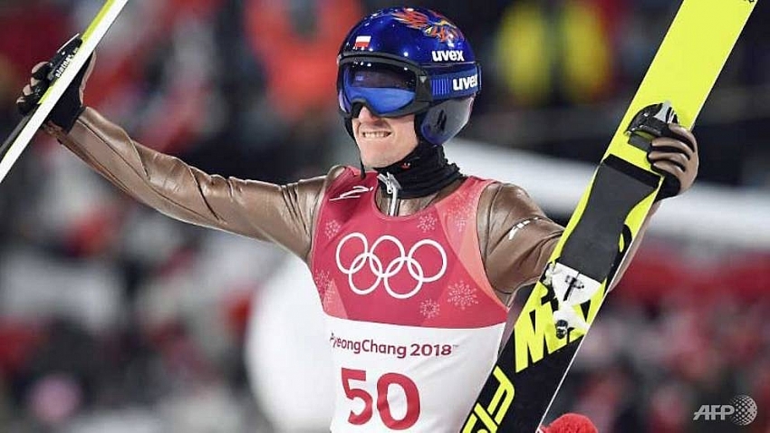 stoch retains ski jump title at the death