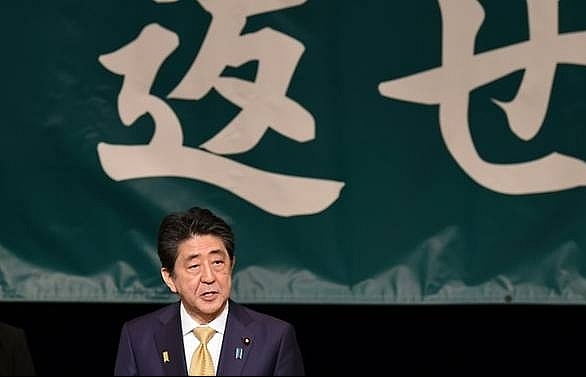 Japan's Abe strikes dovish tone on Russia at Kuril islands rally