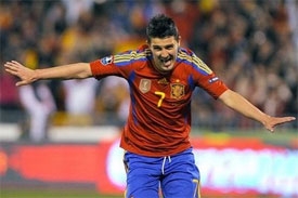 Record breaker Villa to the rescue for Spain