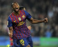 Barcelona midfielder Seydou Keita of Mali celebrates on March 3, after scoring against Sporting Gijon during a Spanish league football match at the Camp Nou stadium in Barcelona.