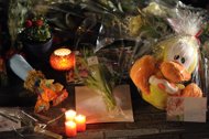 Flowers, candles, drawings and toys are left at the school in Lommel, following the coach crash in Switzerland that killed 28 passengers, many of whom were from the primary school. 