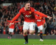 Manchester United's English forward Wayne Rooney celebrates after scoring against Fulham during an English Premier League football match at Old Trafford in Manchester. United won 1-0