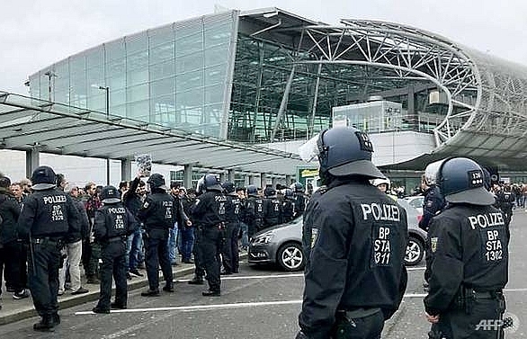 Kurdish protesters clash with police at German airport, disrupt UK stations