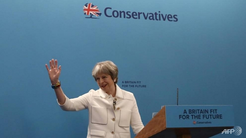 british pm may rallies party with warning to russia