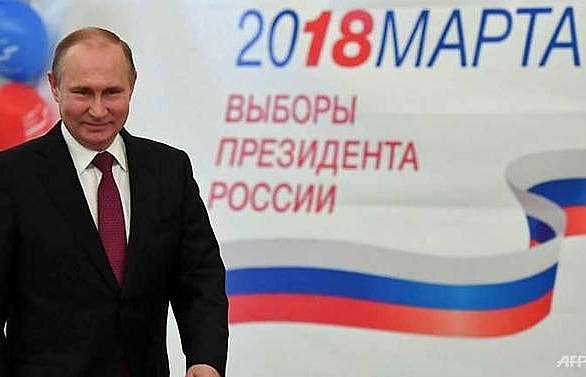 Putin cruises to landslide election win