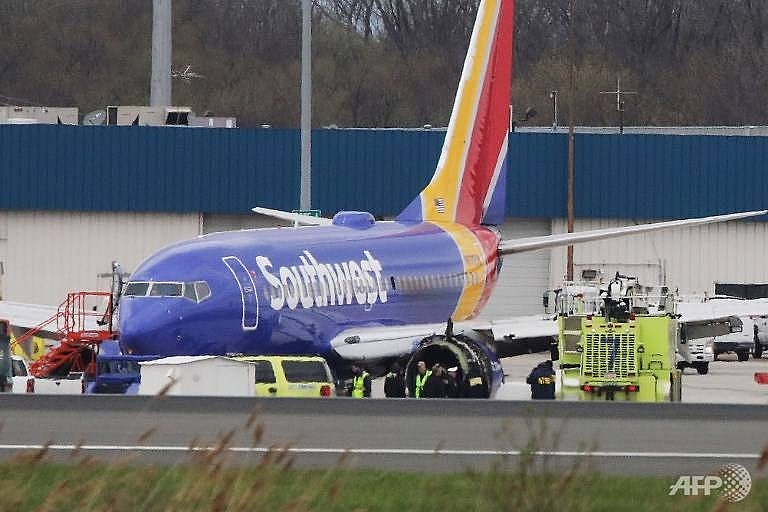 passenger nearly sucked out and killed after engine breaks apart on southwest flight