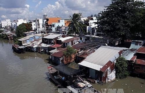 Households along HCM City canals can’t afford resettlement apartments
