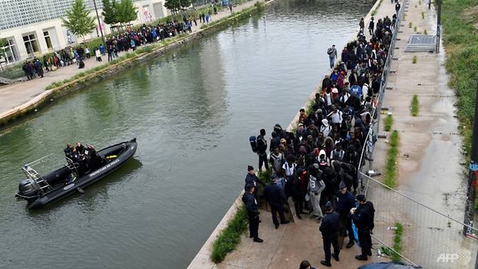 police clear paris camp as migrant debate flares in france
