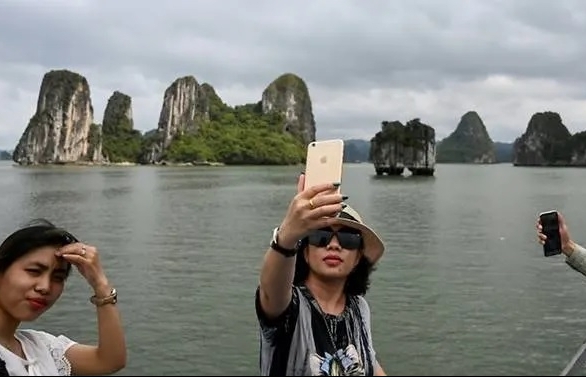 Tourists back in Vietnam's Ha Long Bay as domestic travel restarts after easing of COVID-19 measures
