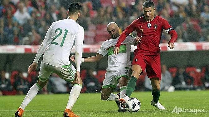 ronaldos return inspires portugal past algeria