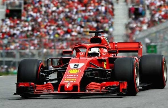 Vettel claims 50th win and goes top in title race