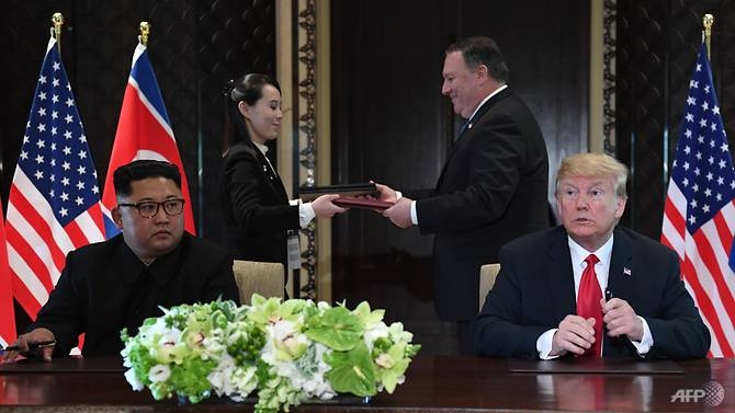 kim jong un commits to complete denuclearisation in joint text with trump at singapore summit