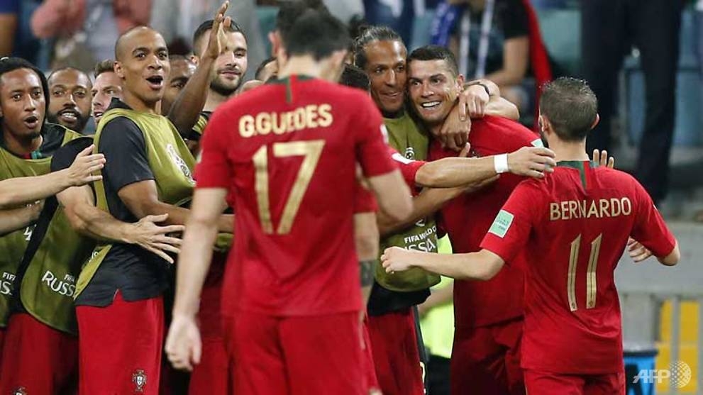 world cup ronaldo hits hat trick as portugal deny spain