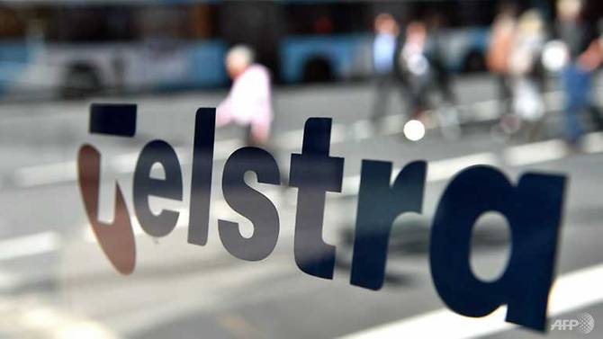australian telecom giant telstra to axe 8000 jobs