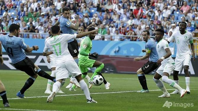 suarez sends uruguay into last 16 with hosts russia