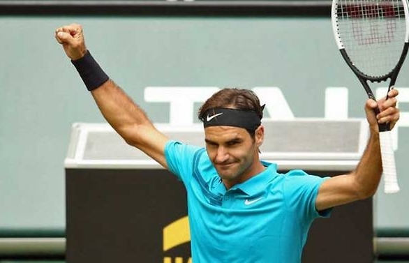 Federer saves two match points to reach Halle quarter-finals