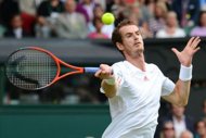 Britain's Andy Murray plays a forehand shot during his men's singles quarter-final match against Spain's David Ferrer on day nine of the 2012 Wimbledon Championships tennis tournament at the All England Tennis Club in Wimbledon, southwest London. Murray survived a gruelling examination from Spain's David Ferrer to reach the Wimbledon semi-finals for the fourth successive year. (AFP Photo/Leon Neal)