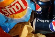 PepsiCo's Frito-Lay brand and cans of their Pepsi soda are shown in Miami, Florida. Global drinks and snacks giant PepsiCo said Monday it will enter the fast-growing US yogurt market this month, teaming up with a German dairy company to introduce premium European products. (AFP Photo/Joe Raedle)