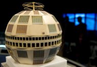 A model of the Telstar satellite is seen on stage beofre the start of an event to mark the 50th anniversary of the first live television broadcast between continents. (AFP Photo/Mandel Ngan)