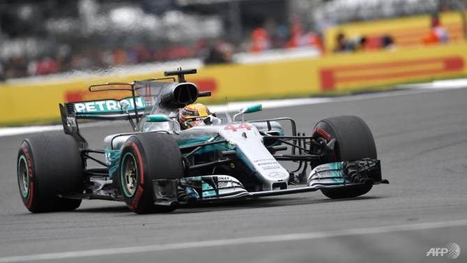 Hamilton reigns at Silverstone to cut Vettel lead