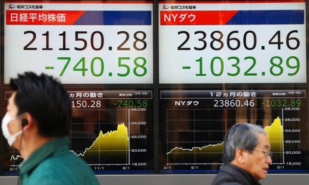 asian markets mostly down as data shows china growth slowing