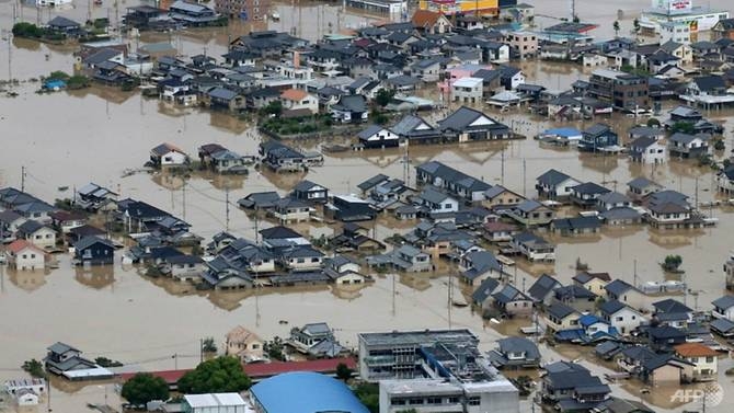typhoon barrels towards flood hit western japan