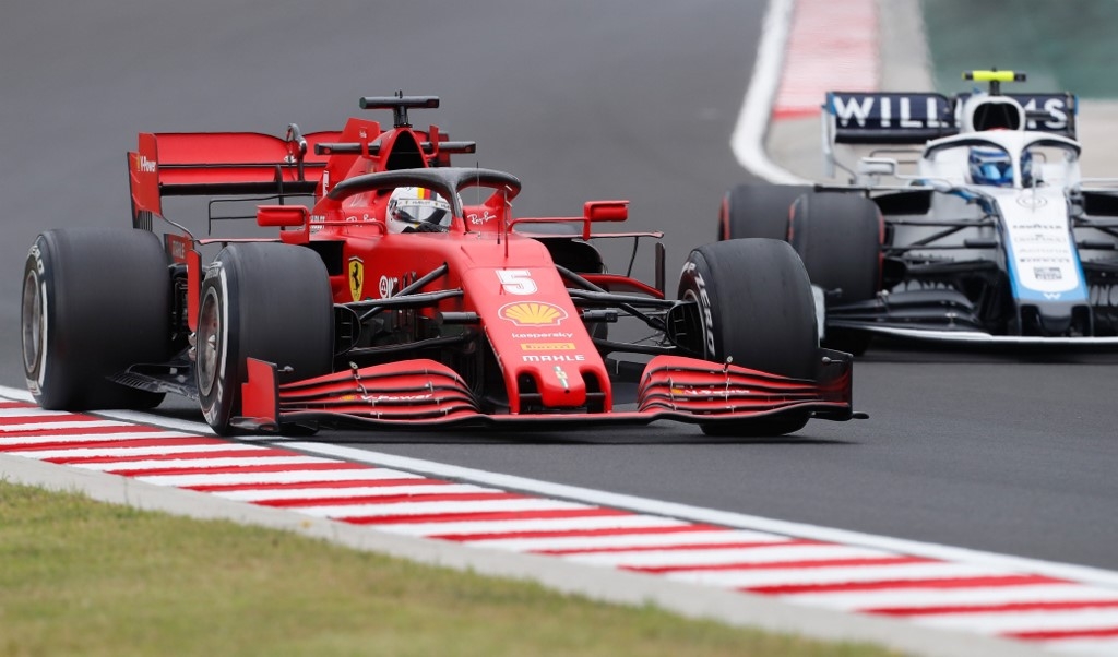 Vettel shines in wet Hungarian practice as Hamilton takes rain check
