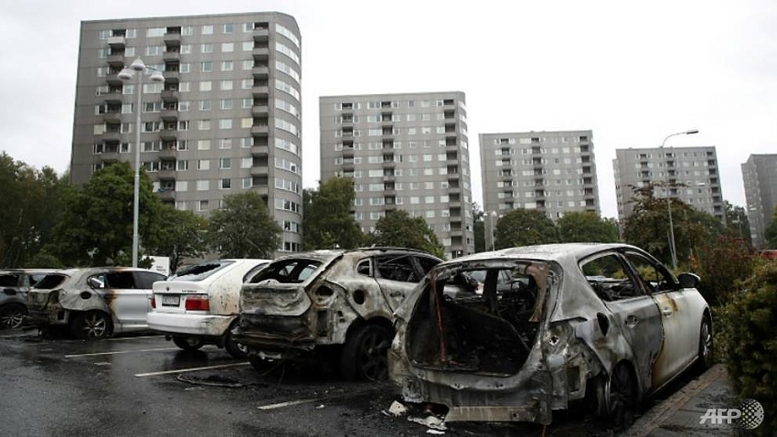 masked vandals torch dozens of cars in sweden
