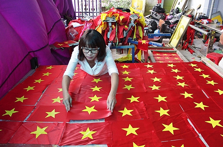 flag makers sewing up a storm before national day