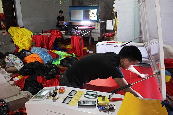 flag makers sewing up a storm before national day