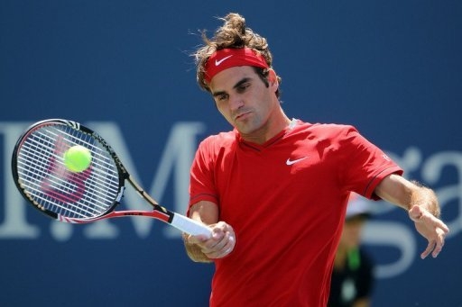Federer, Serena untroubled at stricken US Open