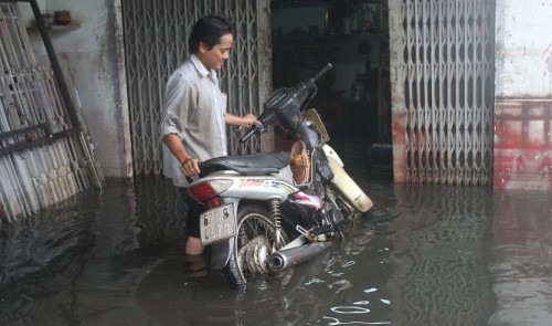 ho chi minh city district almost sinks beneath rainwater