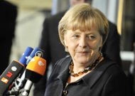 Merkel, Sarkozy maintain crisis cure in sight