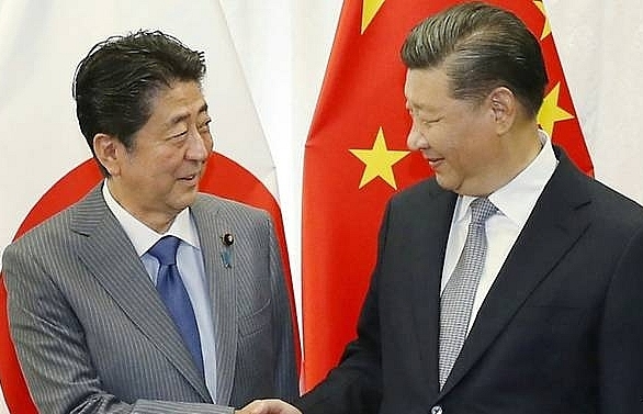Japan's Abe to make rare China visit as relations thaw