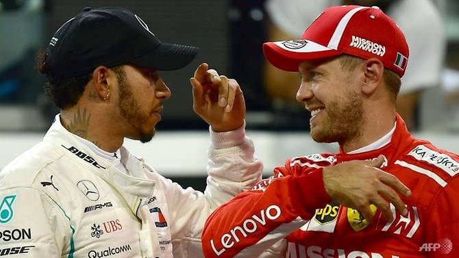 Foes Hamilton and Vettel swap helmets