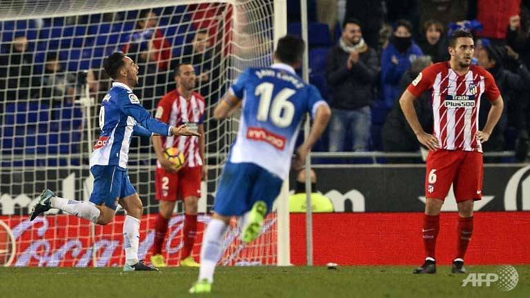 espanyol inflict atleticos first league defeat