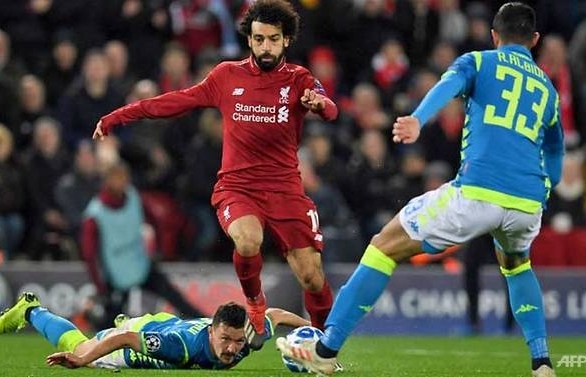 Salah's strike takes Liverpool into last 16 at Napoli's expense