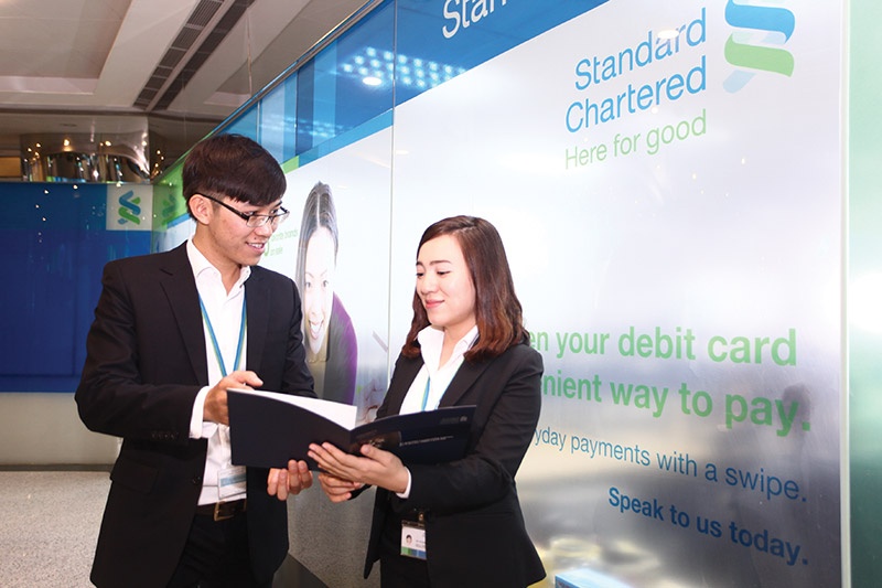 British-based groups like Standard Chartered have made a mark in Vietnam for decades, Photo: Le Toan