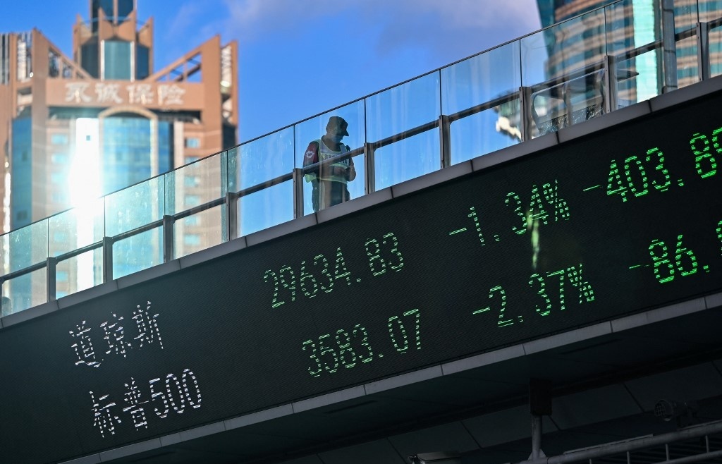 Most Asia markets rise on Fed bets as Hong Kong, Shanghai struggle